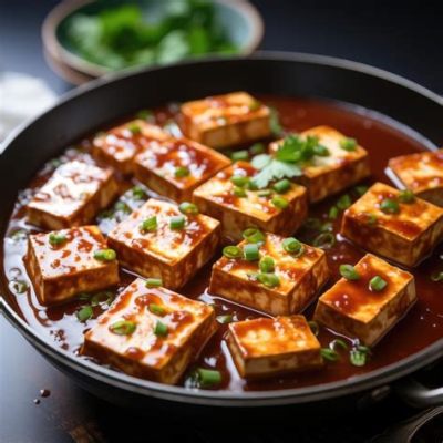  Bijie Heitui Doufu:  Een Pittige Verleiding van Gebraden Tofu en Umami-Rijke Saus!